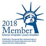 Logo in the semblance of the head of the Statue of Liberty reading 2018 Member - Americas Immigration Lawyers Association. 